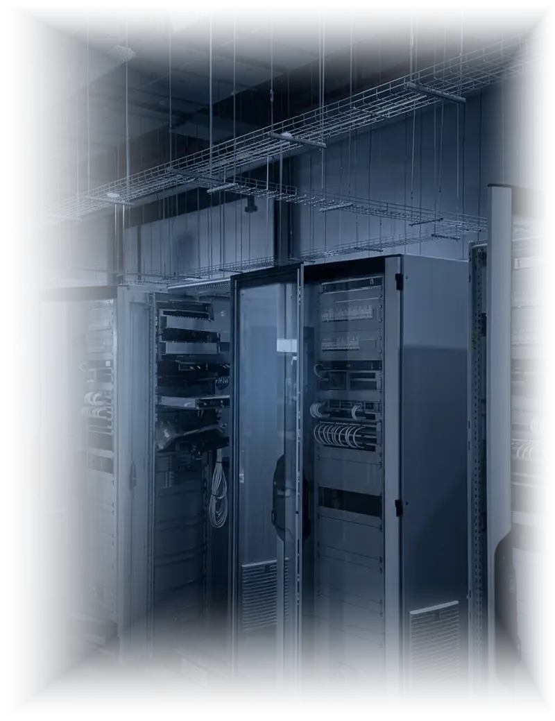 Control panel assembly room at the Integration Center: rows of open steel cabinets being wired and racked beneath overhead cable trays